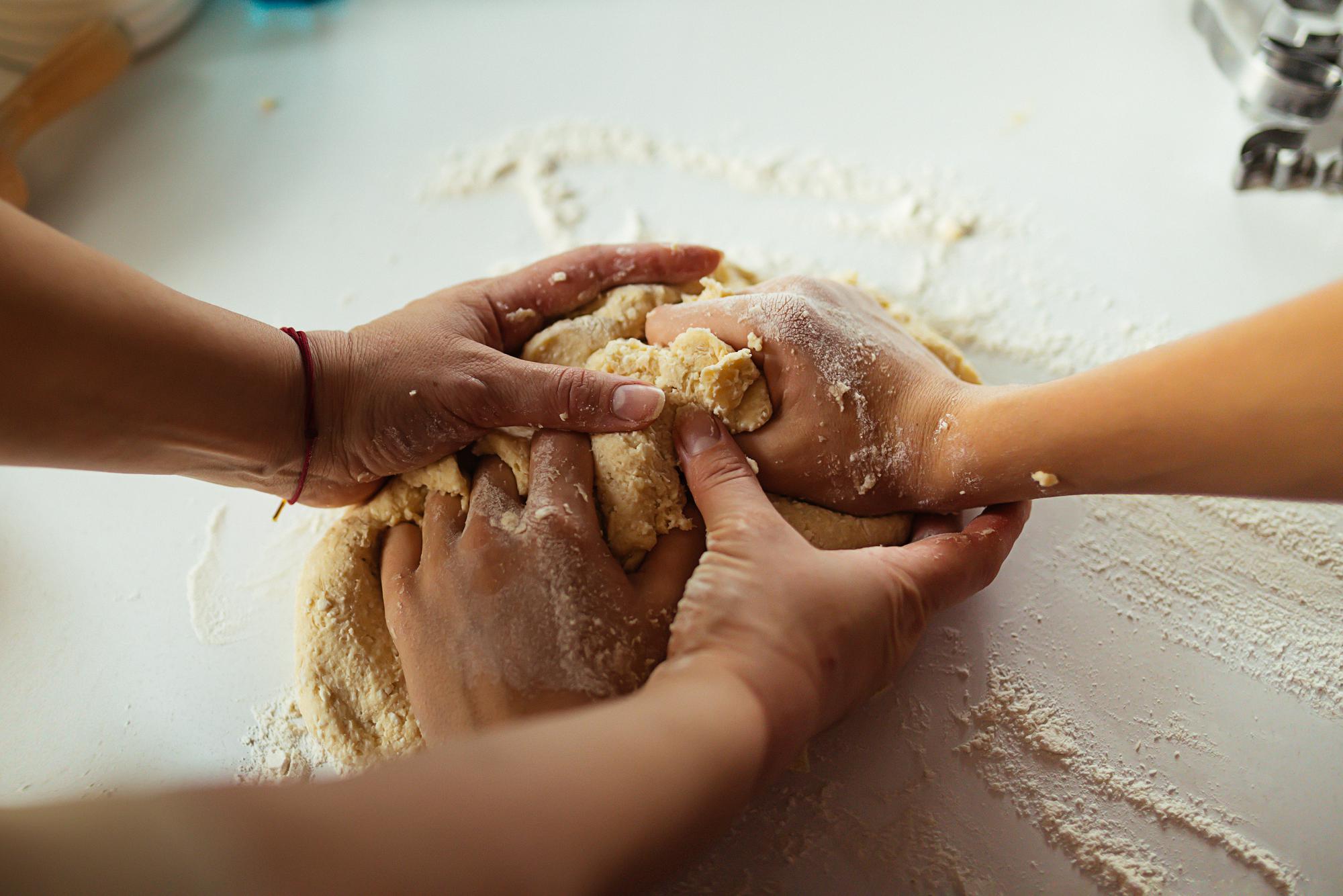 Workshop instructor teaching hands-on bread making