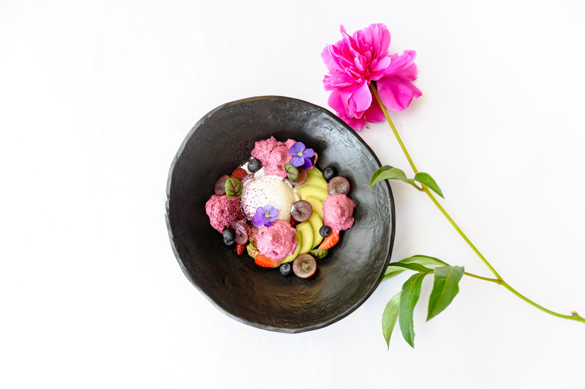 Close-up of plated dessert with edible flowers